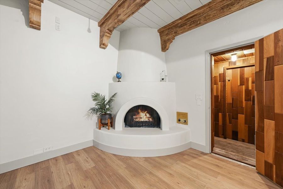 Primary sitting room, fireplace and sauna
