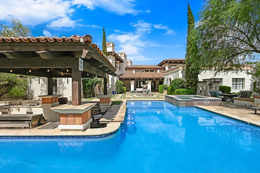 Heated pool with swim-up bar